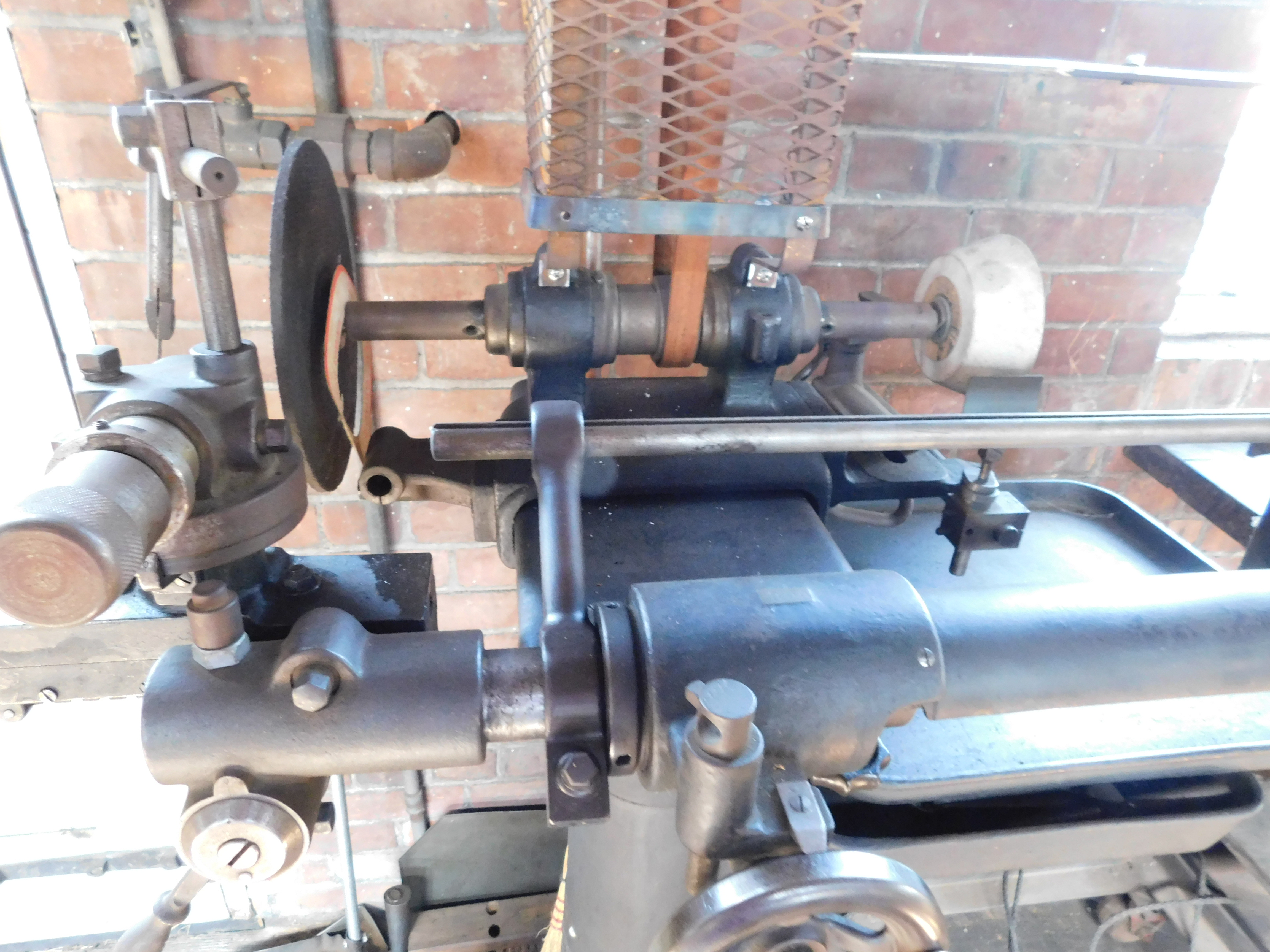   https://antiquemachinery.com/images-HFM/Arlington-and-Sims-Machine-Shop-Edison-Henry-Ford-Museum-DSCN1382-Brown-and-Sharpe-Cutter-Grinder-no-2.JPG  